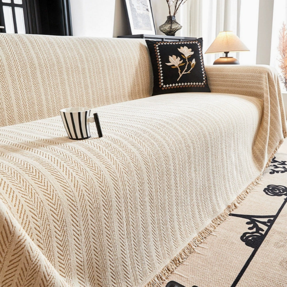 Housse de canapé en chenille à chevrons avec pompons