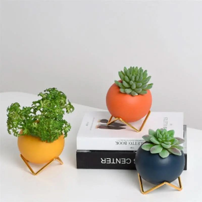 Pot de fleurs en céramique moderne avec support en métal dans des couleurs vives