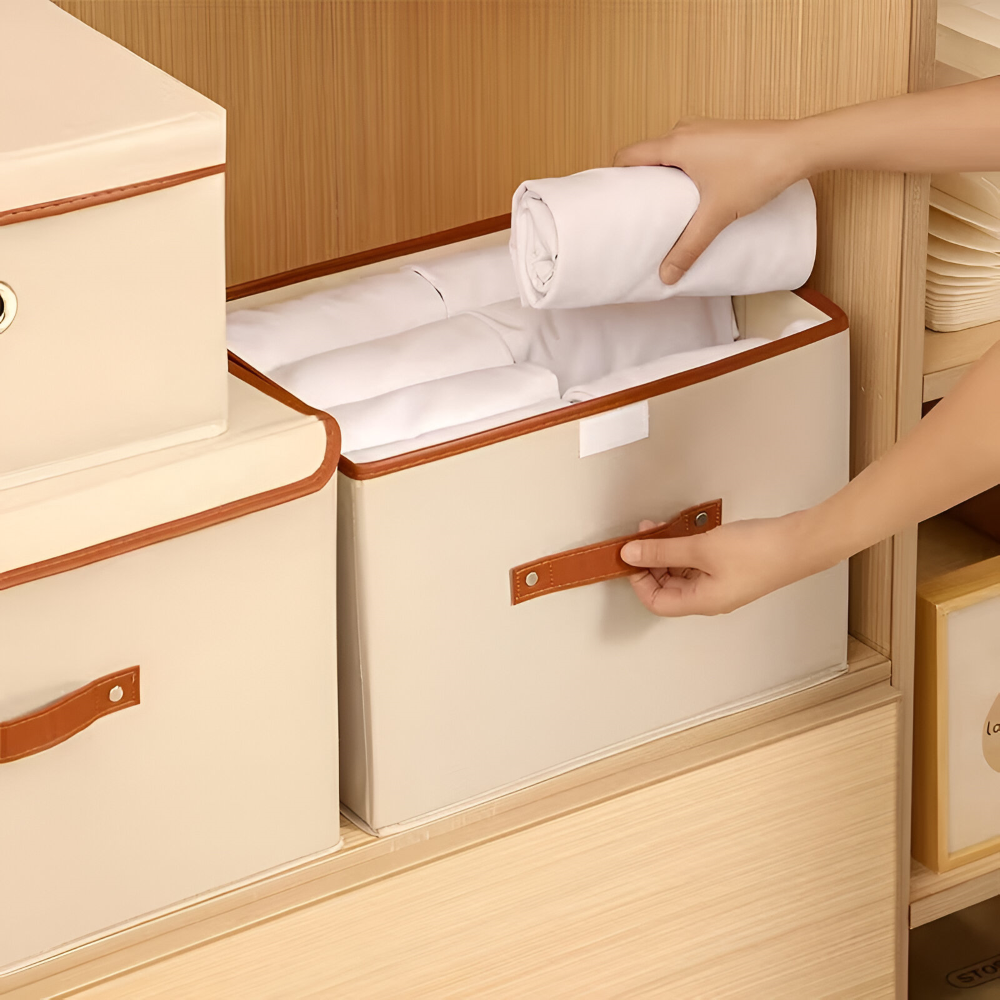 Boîte de rangement pliable avec couvercle et poignées en cuir