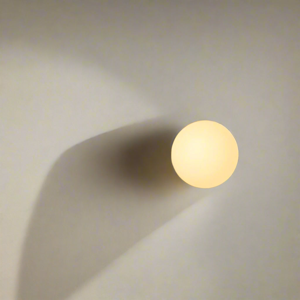 Applique murale à forme ronde plate et lumière diffusée