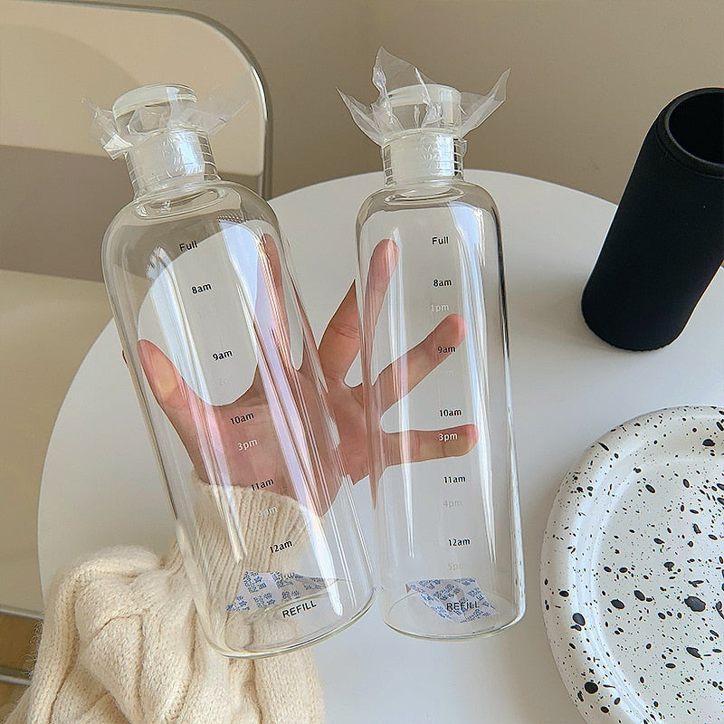 Bouteille d'eau en verre résistante à la chaleur avec échelle horaire