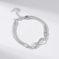 Kelly - Bracelet à breloques Infini élégant
