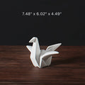 Statue d'oiseau en céramique inspirée de l'origami