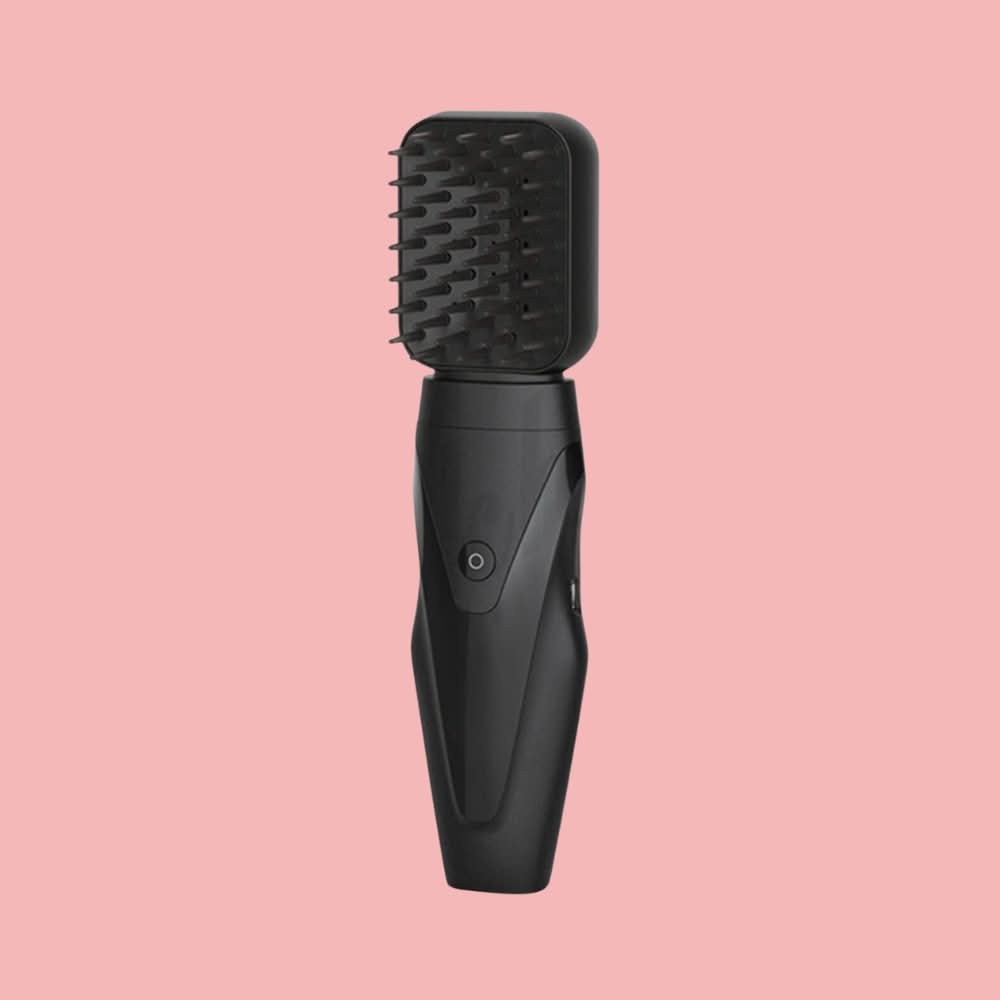 Brosse chauffante à vapeur pour des cheveux parfaitement lisses